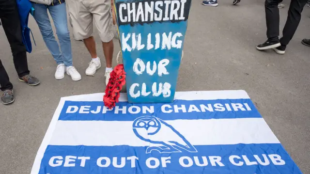Flags and protest material against Sheffield Wednesday owner Dejphon Chansiri