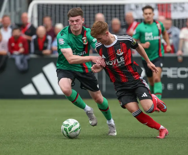 Jordan Jenkins challenges for the ball