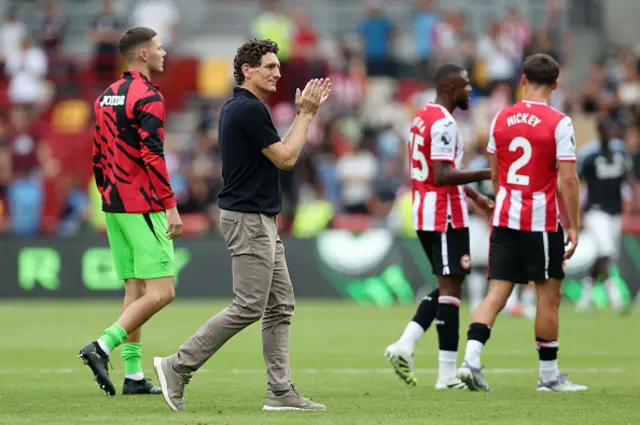 Keith Andrews, Manager of Brentford, applauds the fans