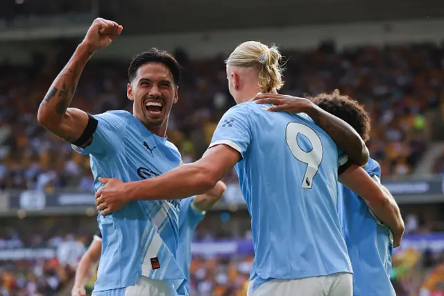 Erling Haaland of Manchester City celebrates with Tijjani Reijnders after scoring