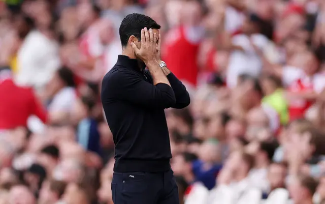 Arteta puts his hands to his face after a missed chance