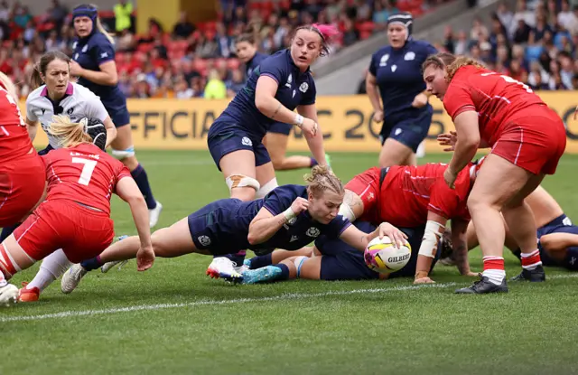 Leia Brebner-Holden of Scotland scores