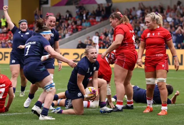 Scotland's Leia Brebner-Holden celebrates scoring against Wales at the World Cup in Salford