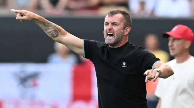 Nathan Jones pointng on the Charlton touchline