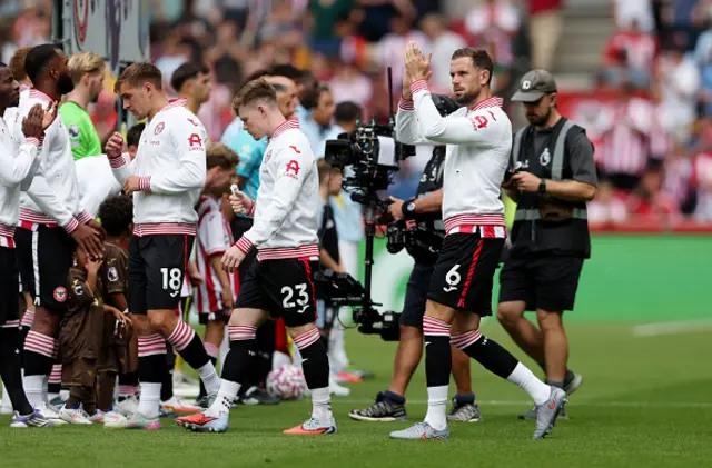 Jordan Henderson of Brentford applauds the fans