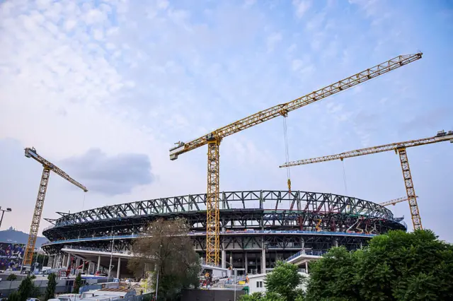 The Nou Camp with cranes around it