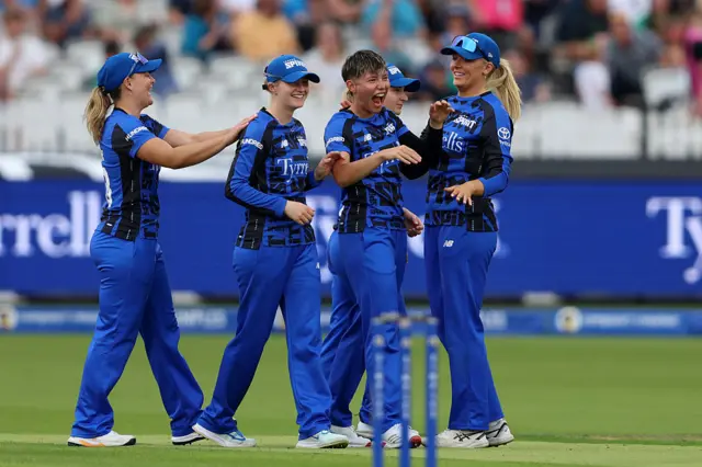 Issy Wong of London Spirit celebrates with teammates after taking the wicket of Danni Wyatt-Hodge of Southern Brave during the The Hundred match between London Spirit Women and Southern Brave Women at Lord's Cricket Ground on August 23, 2025 in London, England.