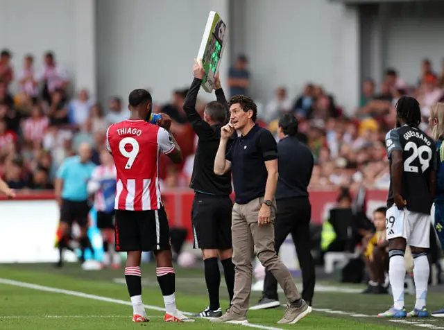 Keith Andrews, Manager of Brentford, interacts with his player Igor Thiago