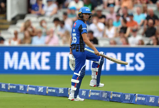Issy Wong of London Spirit walks off over the boundary rope after being dismissed during the The Hundred match between London Spirit Women and Southern Brave Women at Lord's Cricket Ground on August 23, 2025 in London, England.