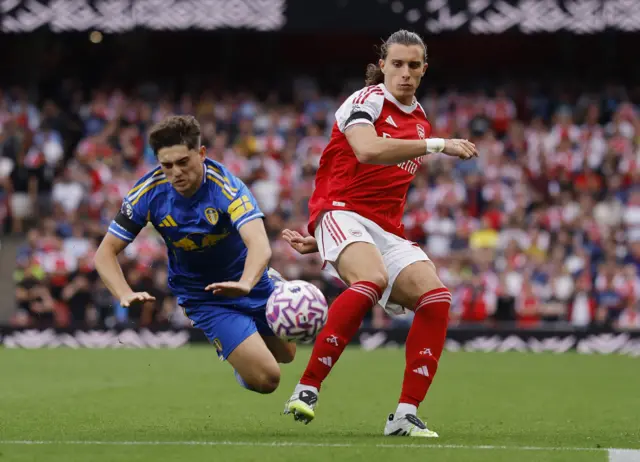 Calafiori and James duel for the ball