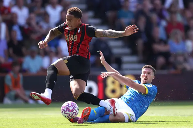Marcus Tavernier of Bournemouth is tackled by Matt Doherty