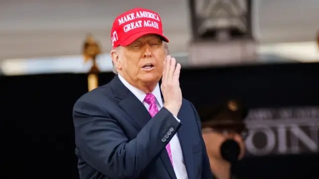 : U.S. President Donald Trump wears a 'Make America Great Again' (MAGA) hat as he attends the commencement ceremony at West Point Military Academy in West Point, New York, U.S., May 24, 2025
