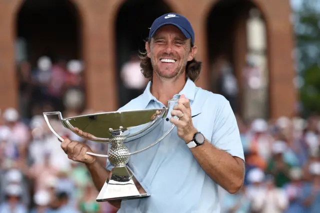 Tommy Fleetwood with Tour Championship trophy
