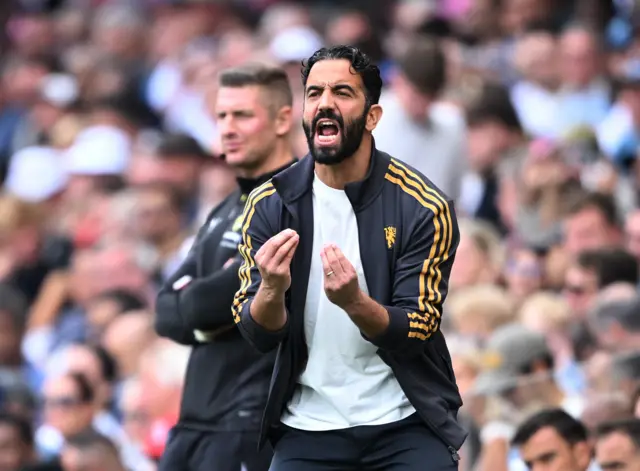 Amorim shouts and gestures at his defenders
