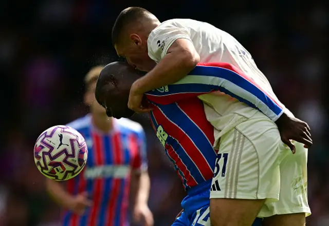 Nikola Milenkovic (R) and Crystal Palace's French striker #14 Jean-Philippe Mateta vie to header the ball