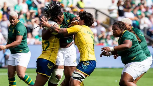 Two Brazil players tackling
