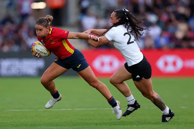 Amalia Argudo of Spain runs with the ball whilst under pressure from Portia Woodman-Wickliffe