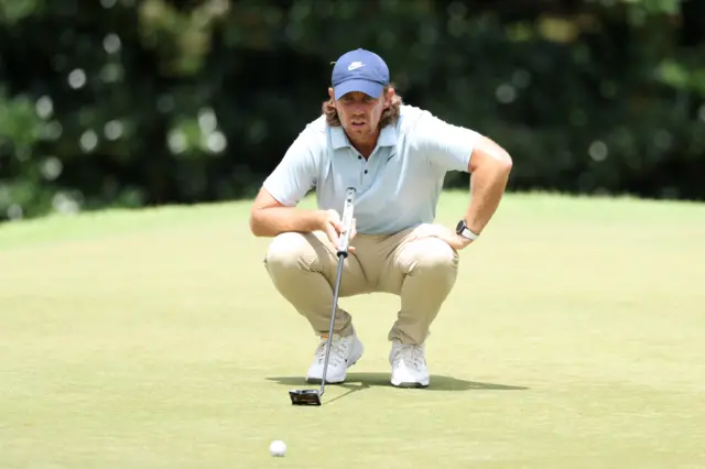 Tommy Fleetwood lines up a putt