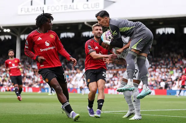 Bayindir catches the ball ahead of his defenders