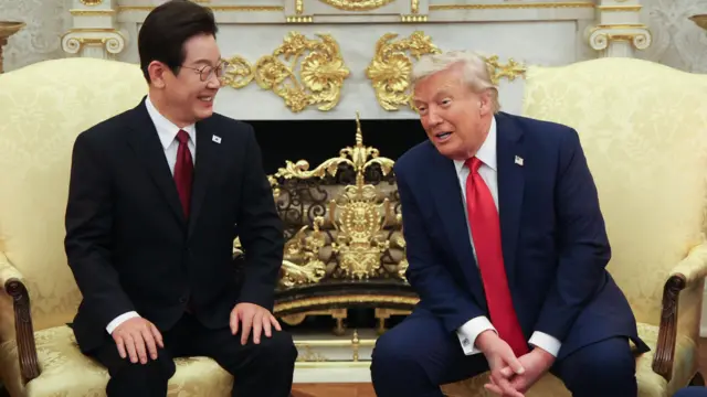 Trump and Lee smiling as they sit next to each other in the Oval Office of the White House