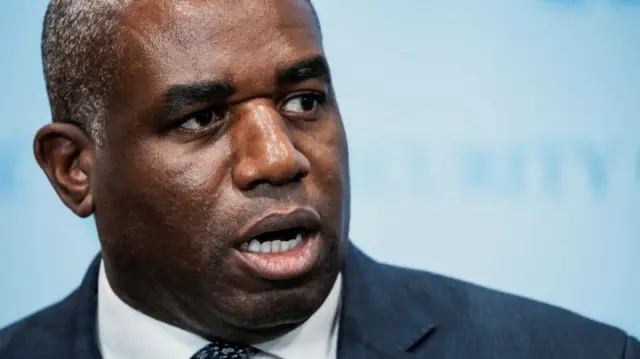 A headshot of David Lammy mid-speaking
