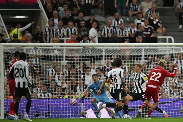 Liverpool's French striker #22 Hugo Ekitike shoots to score their second goal