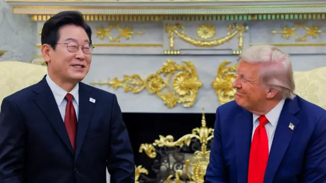 President Donald Trump laughs with South Korean President Lee Jae Myung as the pair meet in the Oval Office