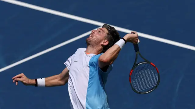 Cameron Norrie serves