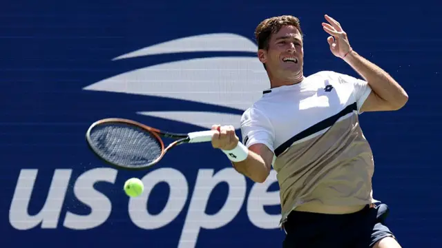 Federico Agustin Gomez plays a forehand shot against Jack Draper