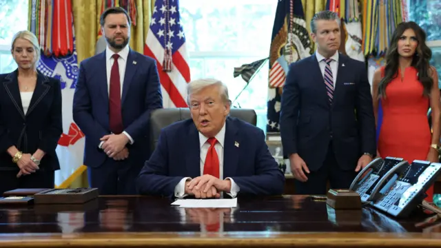 US President Donald Trump speaks in the Oval Office accompanied by U.S. Attorney General Pam Bondi, U.S. Vice President JD Vance, U.S. Defense Secretary Pete Hegseth and U.S. Homeland Security Secretary Kristi Noem, during an event to sign an executive order,