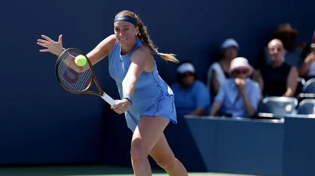 Petra Kvitova of the Czech Republic returns a shot against Diane Parry of France