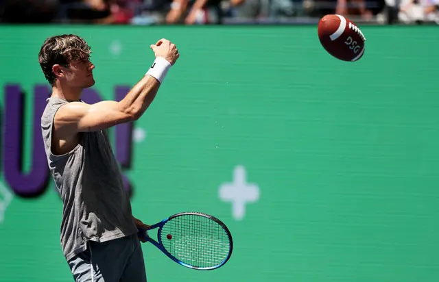Jack Draper throws American football during training session at US Open