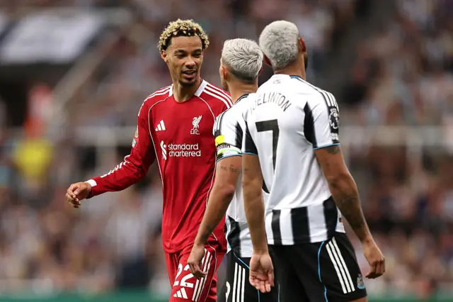 Hugo Ekitike of Liverpool interacts with Bruno Guimaraes