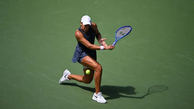 Madison Keys plays a backhand return