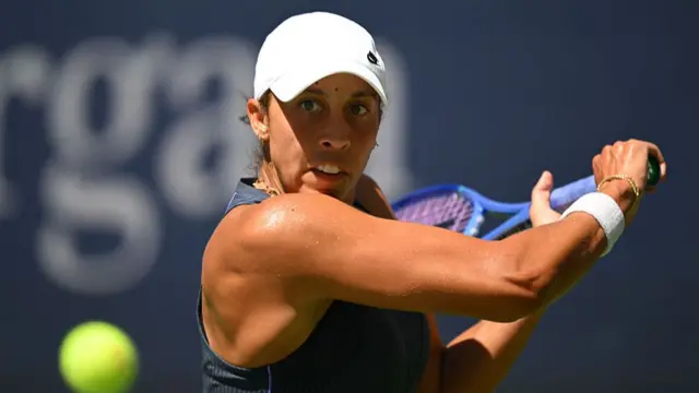 Madison Keys plays a backhand return