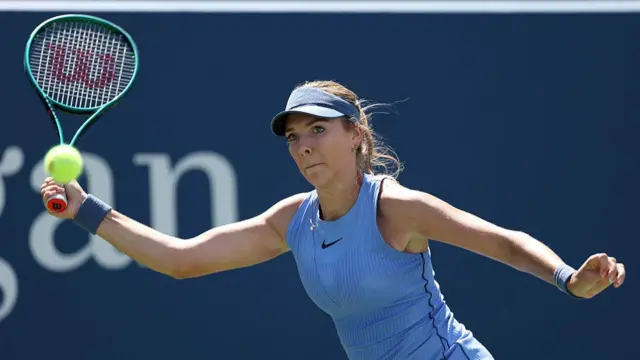 Katie Boulter of Great Britain returns a shot