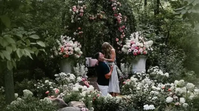Taylor Swift and Travis Kelce surrounded by flowers