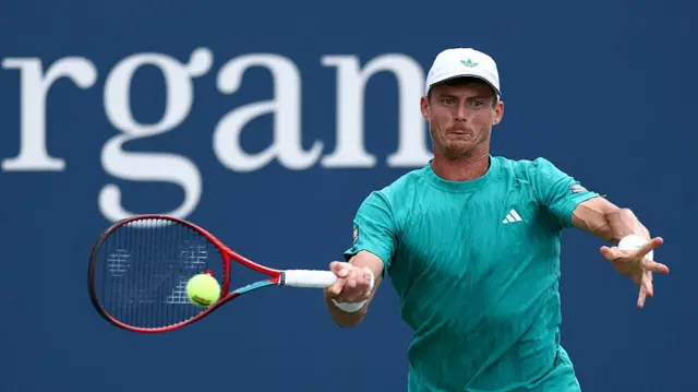 Billy Harris of Great Britain hits a forehand