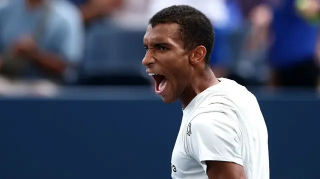Felix Auger-Aliassime shouts after breaking serve