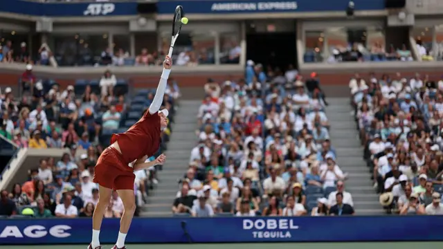 Jannik Sinner of Italy serves