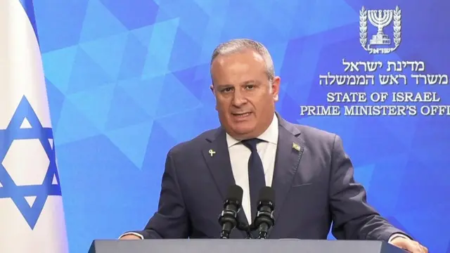 David Mencer gives a news briefing