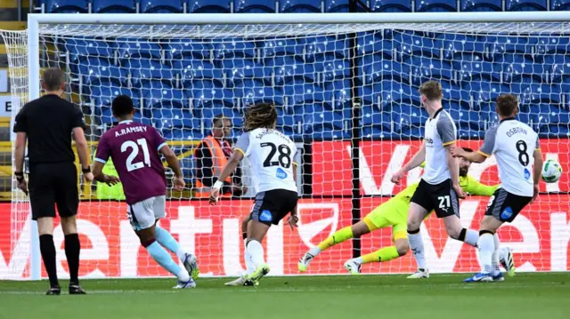 Aaron Ramsey scores for Burnley against Derby County in the Carabao Cup second round