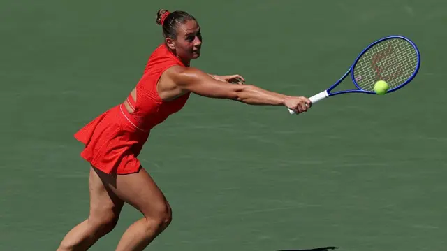 Marta Kostyuk hits a backhand return
