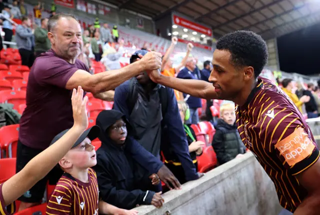 Ibou Touray of Bradford City interacts with fans