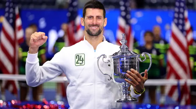 Novak Djokovic holds the US Open trophy