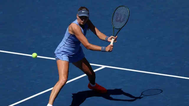 Katie Boulter of Great Britain returns a shot