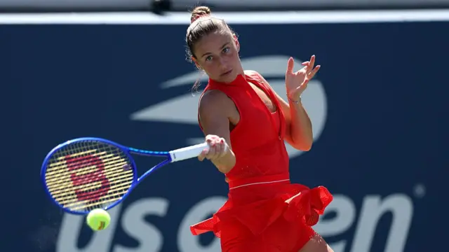 Marta Kostyuk of Ukraine returns against Katie Boulter of Great Britain