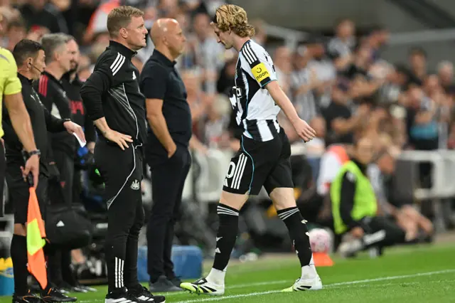 Anthony Gordon walks off, with Eddie Howe watching on