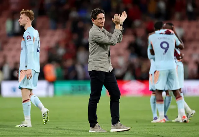 Keith Andrews, Manager of Brentford, applauds the fans