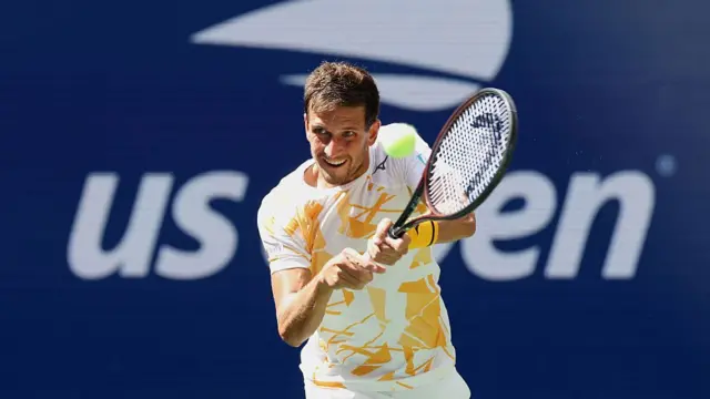 Vit Kopriva hits a backhand return
